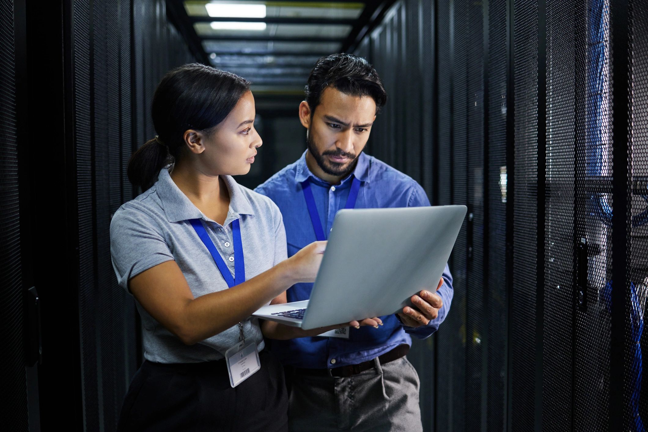 Laptop, server room and technician people problem solving.